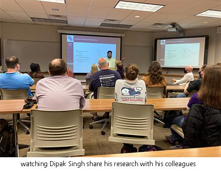 watching Dipak Singh share his research with his colleagues