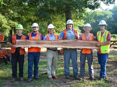 Weaver joined SFA forestry students during their final activity at field station this summer. While there, he learned about the sawing and grading process students engage in during harvesting and processing week.