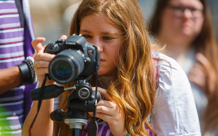 SFA student taking a photograph