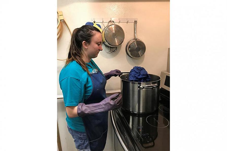 Chandler senior theater major Jessica Griffin dyes fabric for one of the costumes she designed.