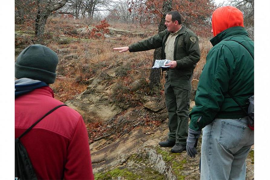 Kyle Thoreson addresses visitors during an interpretive hike.
