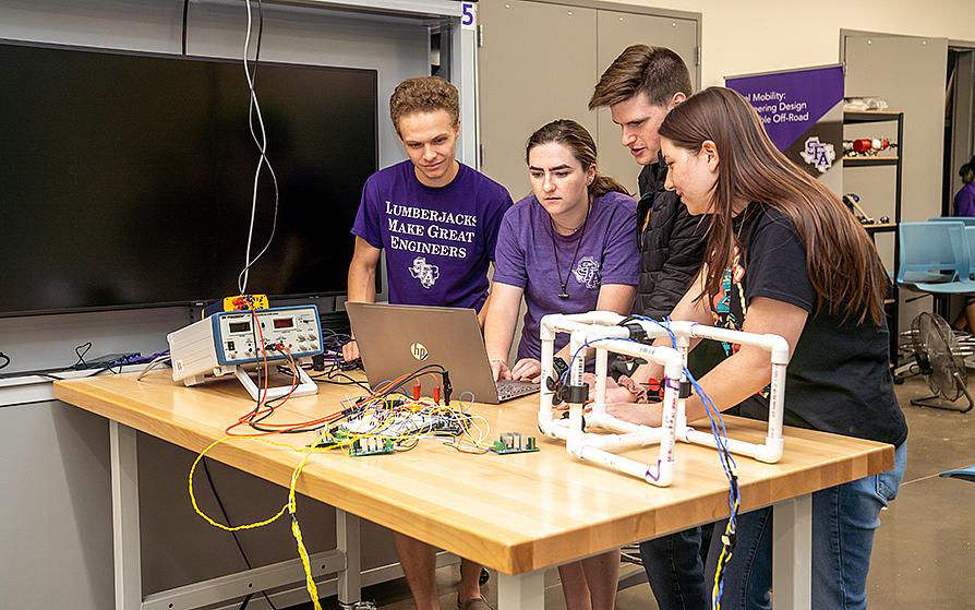 Electrical Engineering students working on a project