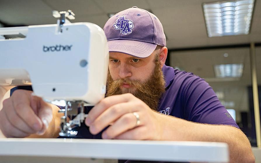 Employee using sewing machine