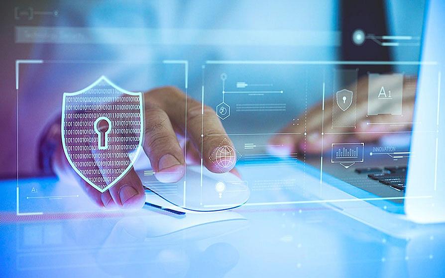 Stock photo of cyber security expert on a computer