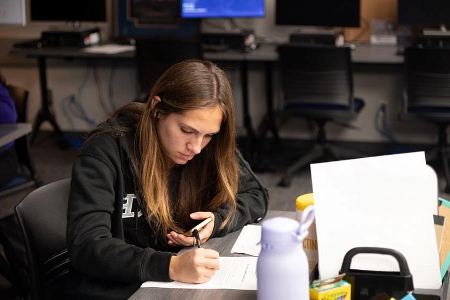 female student writing